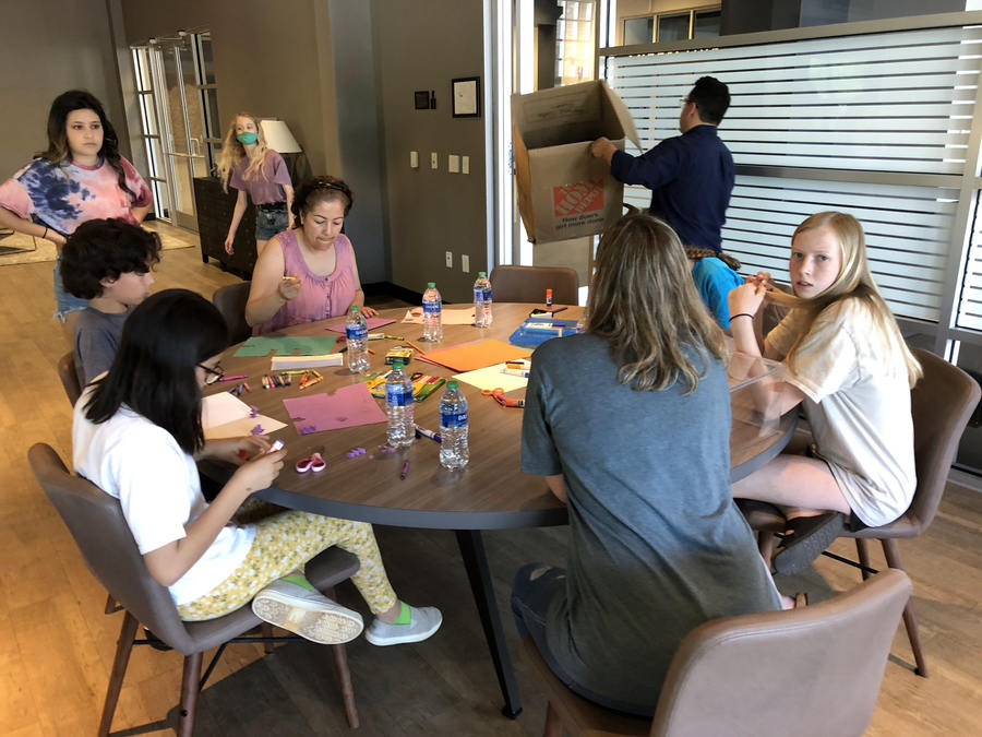 team writing loving letters to children