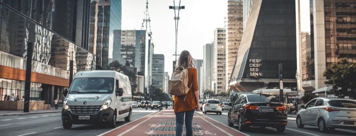 girl walking through high city