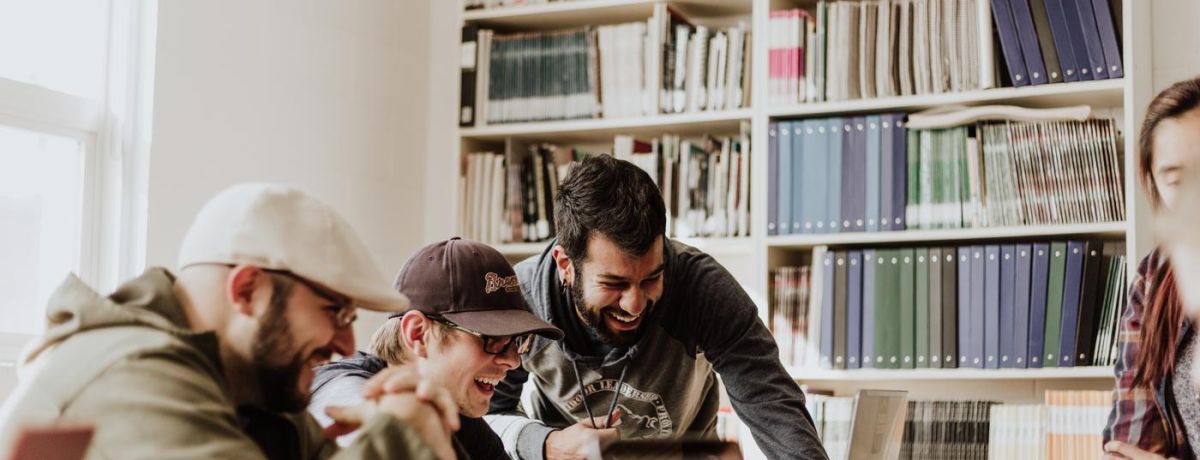people sharing and laughing indoors