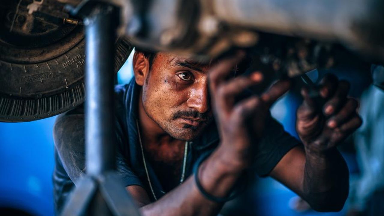 Mechanic Working Hard On A Car
