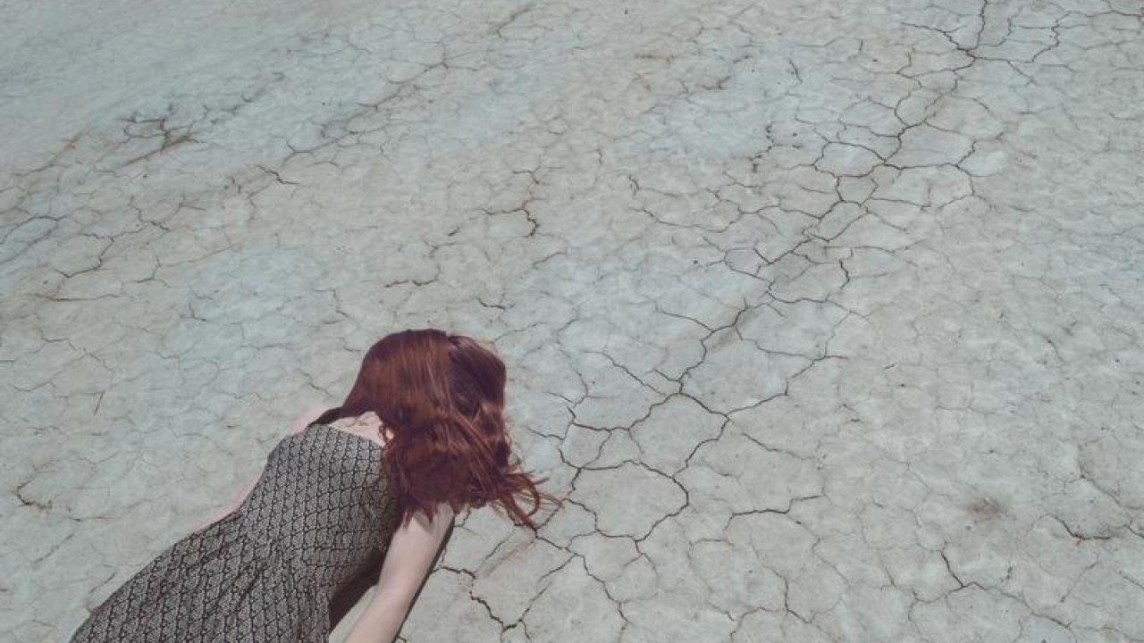 Girl Lost In Desert, laying down