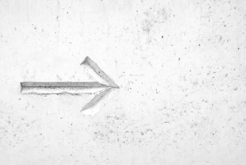 arrow in the white sand