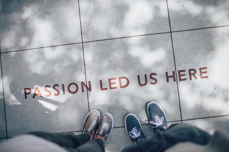 passion led us here, sign with feet