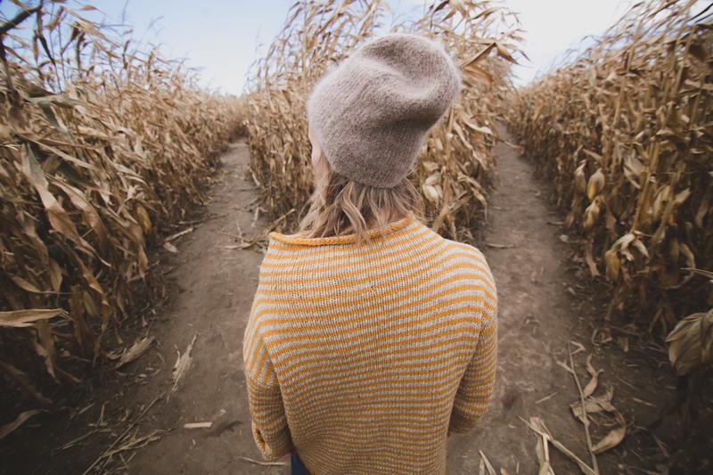 girl looking at a fork in her path