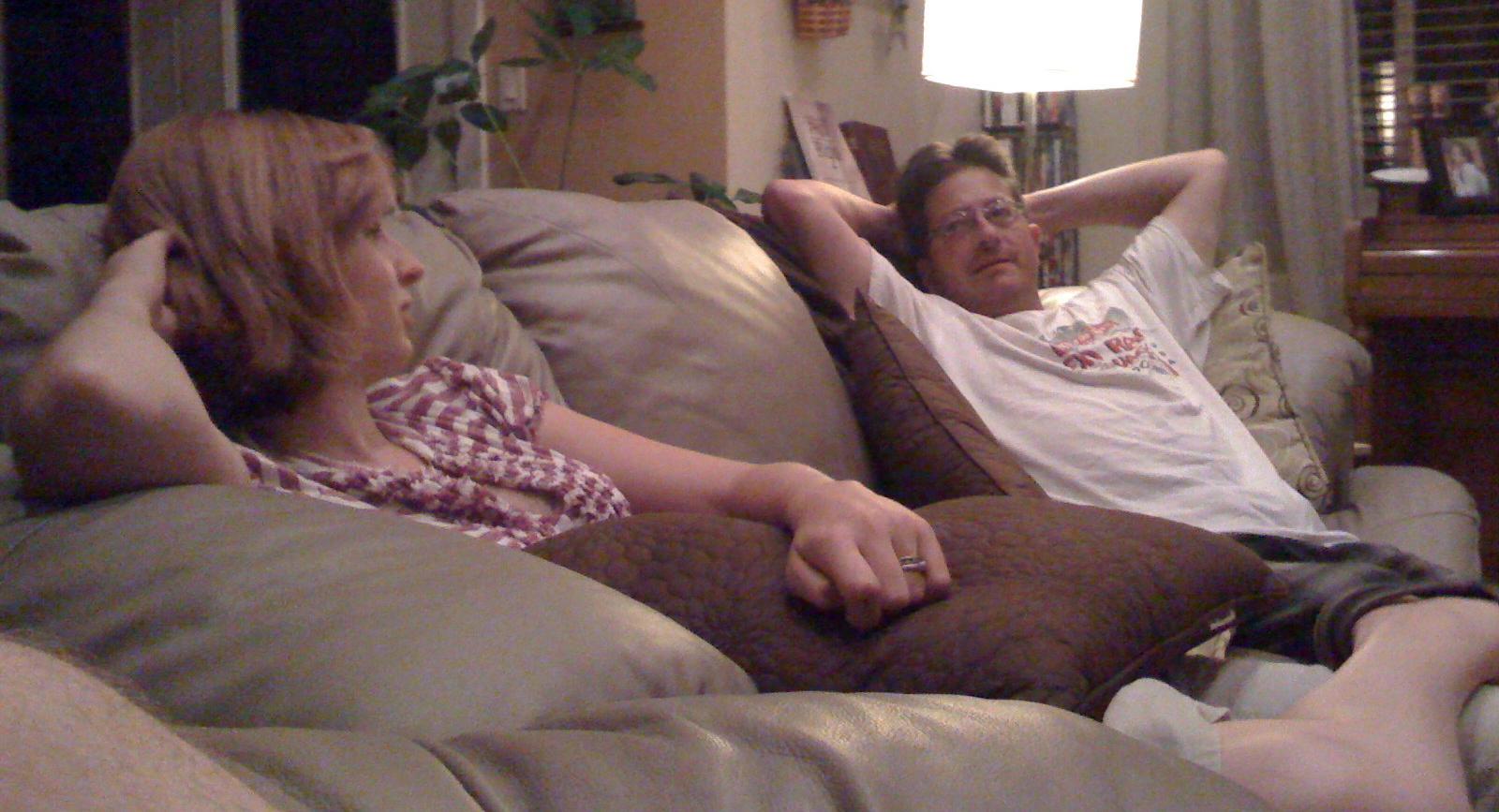 cait and steve montoya talking on the couch