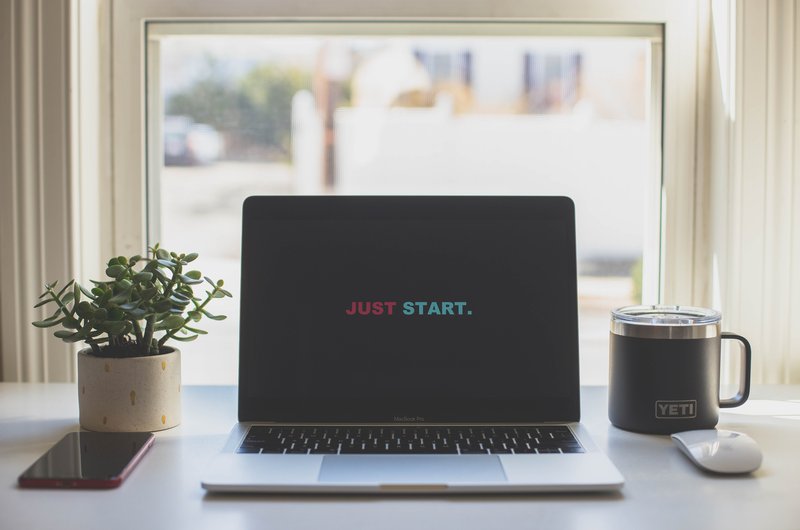 just start on a computer laptop on a desk inside a home office