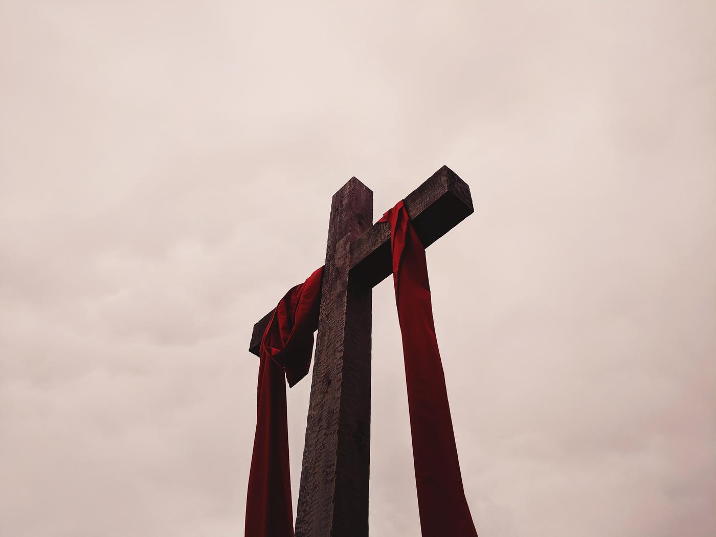 cross, with red draping cloth, outdoors
