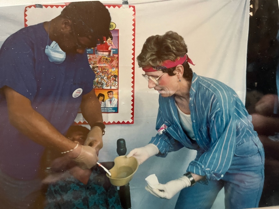 on a mission trip, helping a dentist