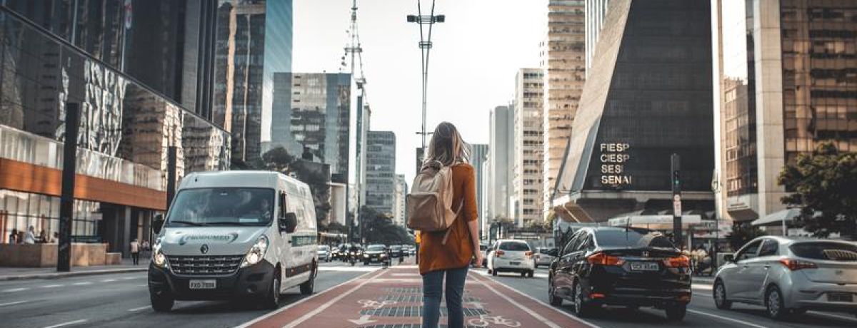 girl walking through high city