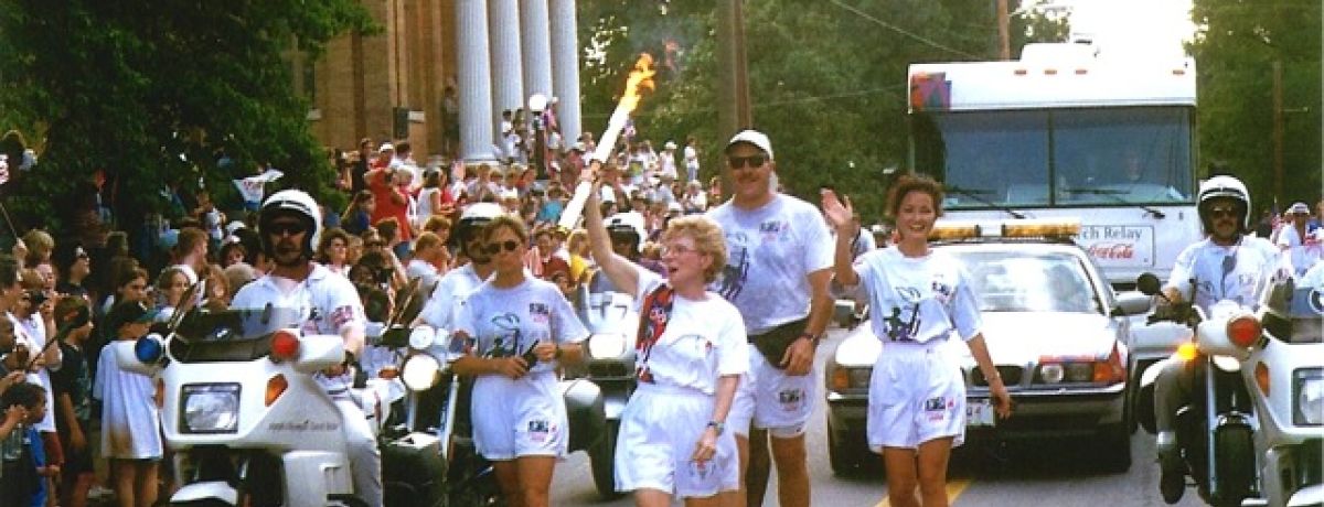 deenie mckeever, carrying 1996 olympic torch in cartersville georgia
