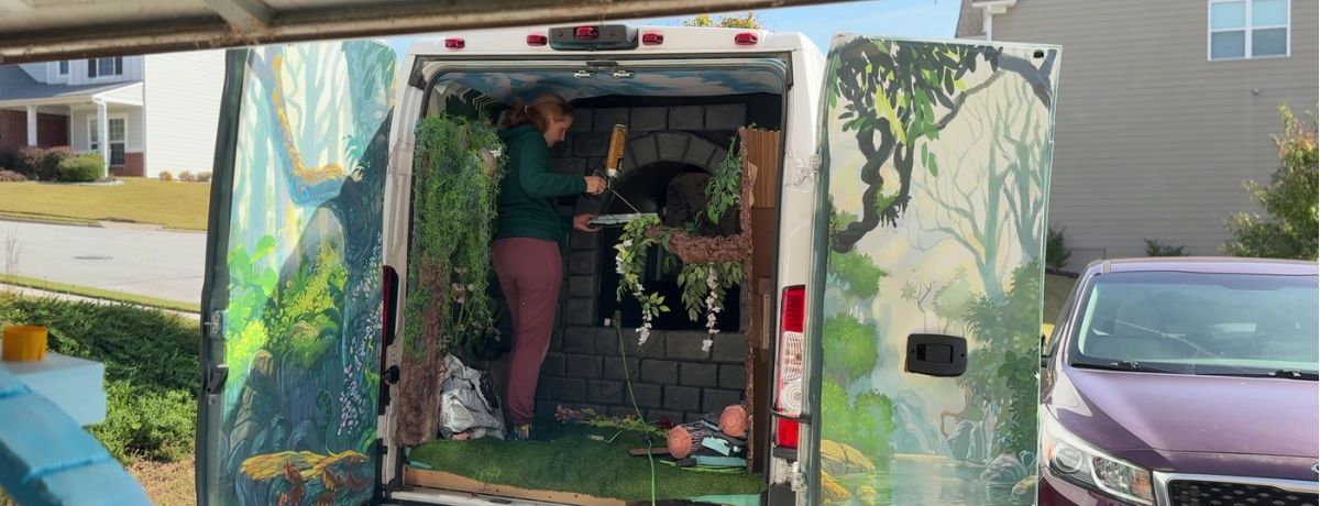 cait working on foam brick wall in cargo van