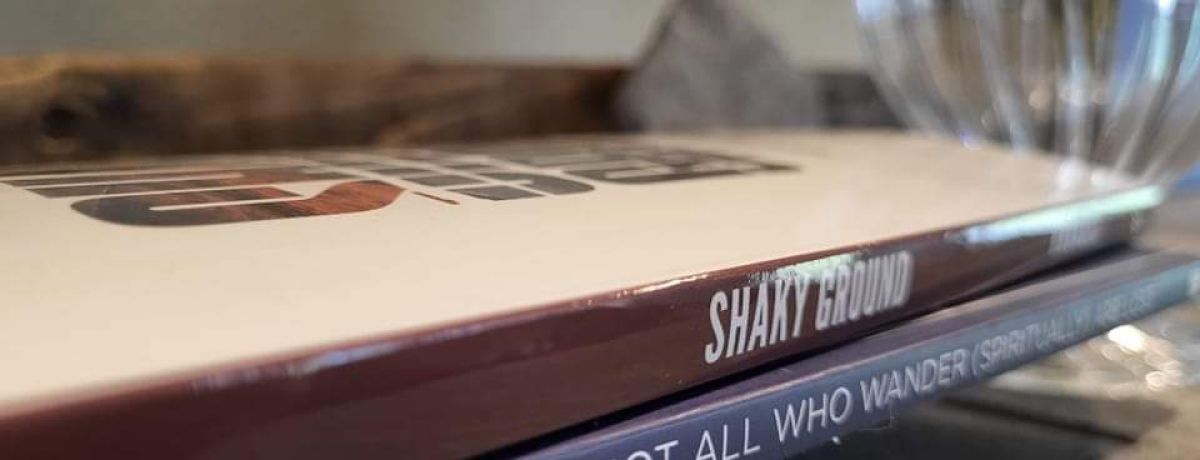 Traci Rhoades, Shaky Ground book stack, indoors