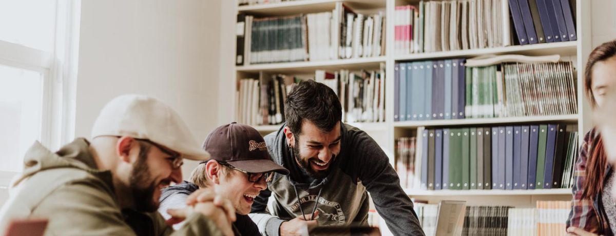 people sharing and laughing indoors