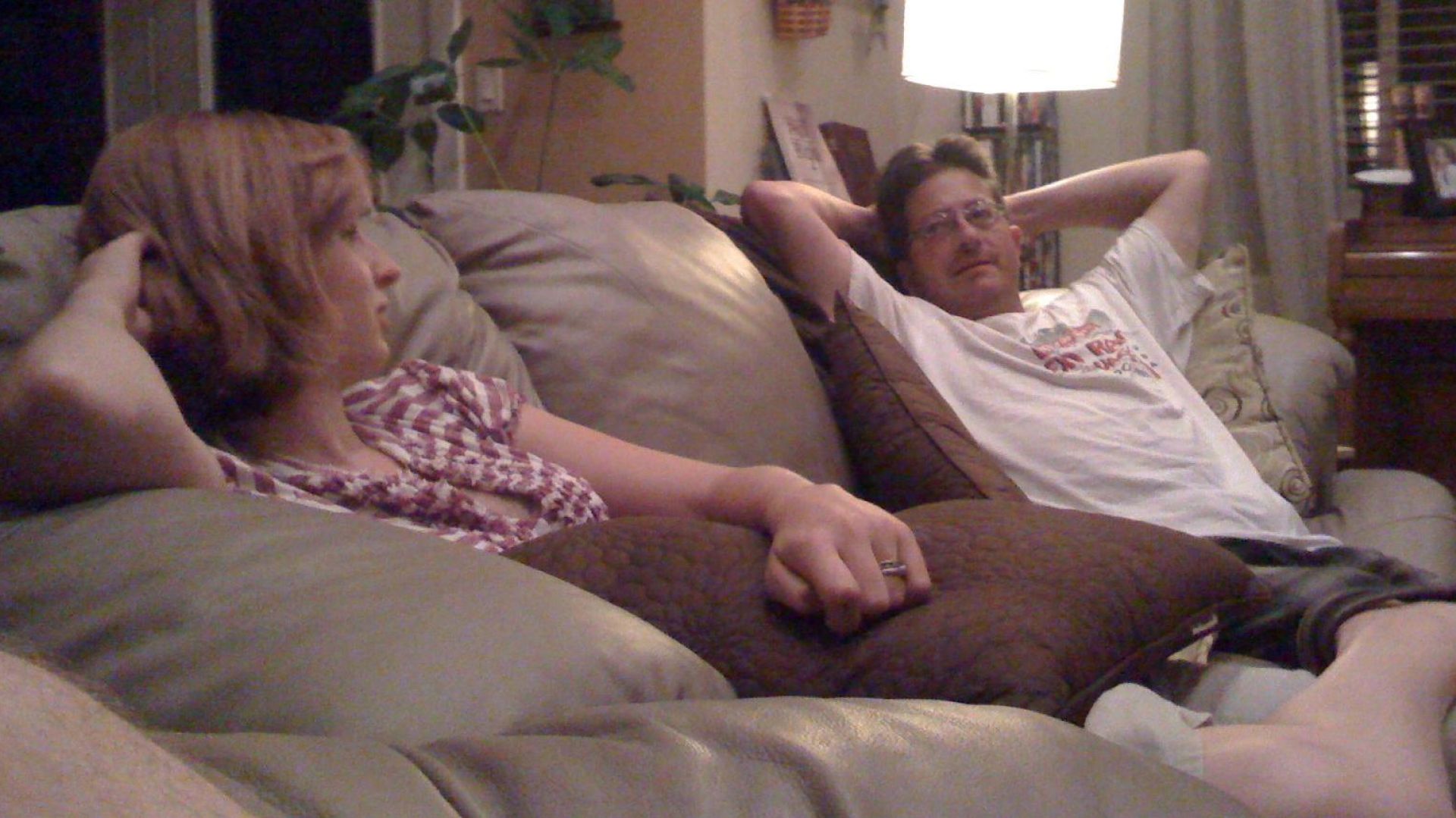 cait and steve montoya talking on the couch