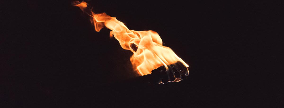 Fire torch in the darkness