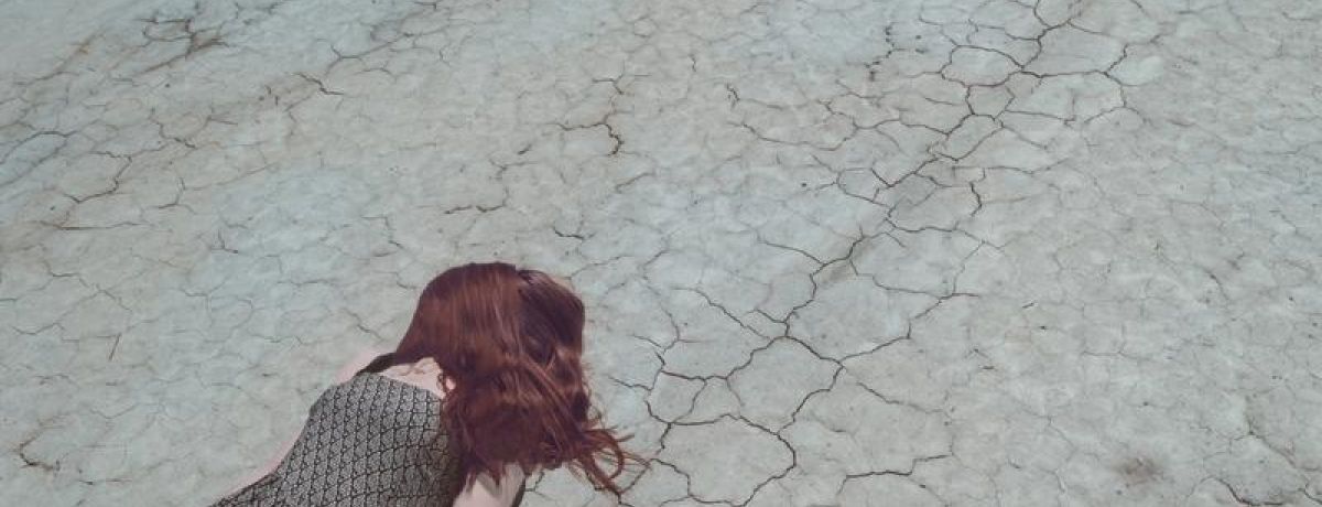 Girl Lost In Desert, laying down