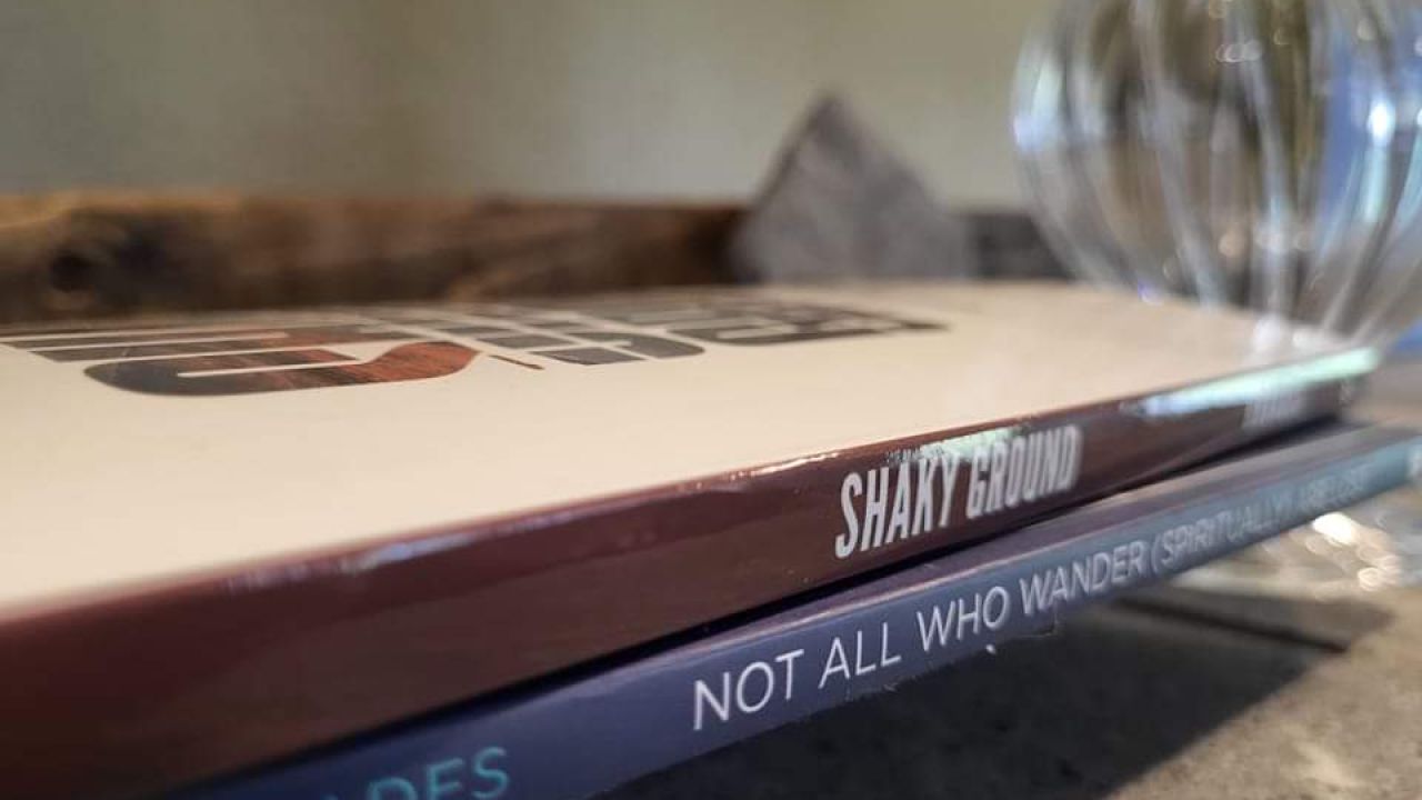 Traci Rhoades, Shaky Ground book stack, indoors