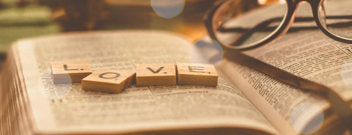 love letters on the bible on a desk with glasses