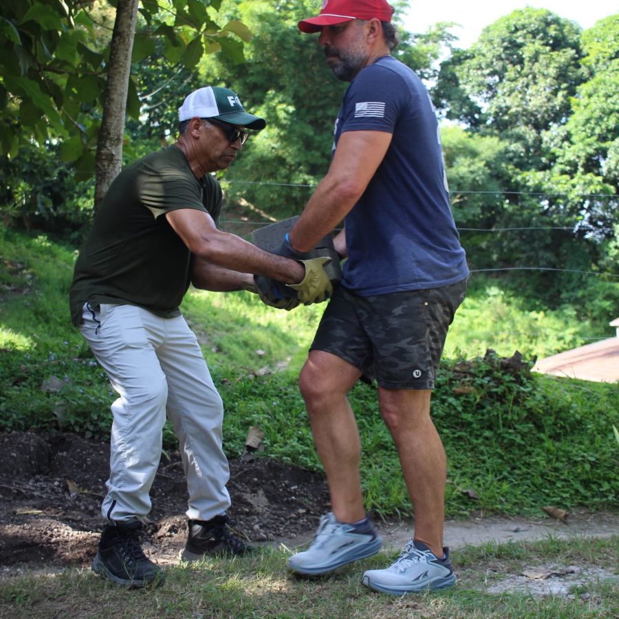 men praying for someone