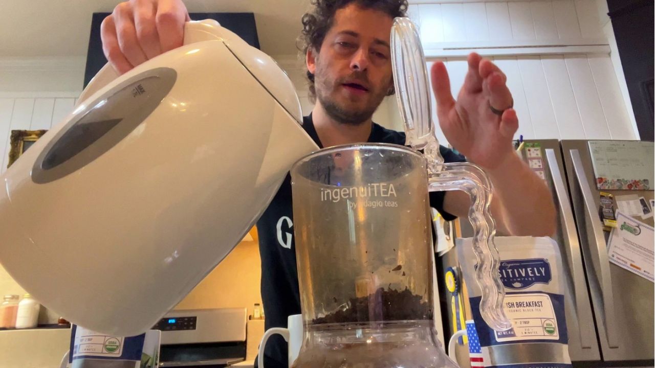 jason montoya, pouring hot water into tea infuser
