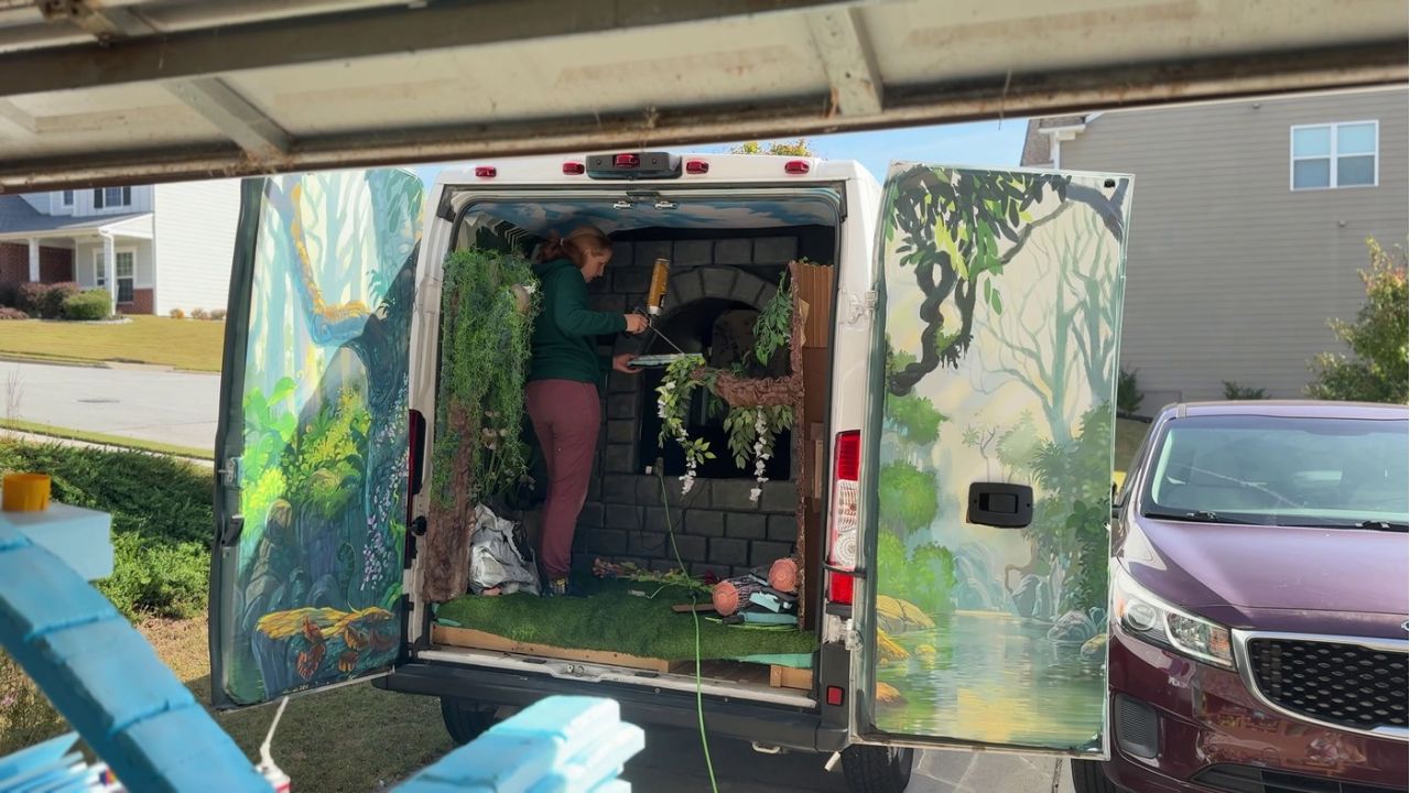 cait working on foam brick wall in cargo van