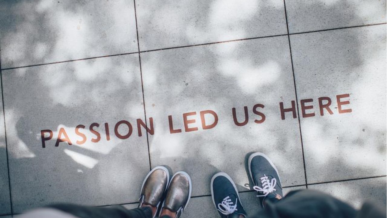 passion led us here, sign with feet
