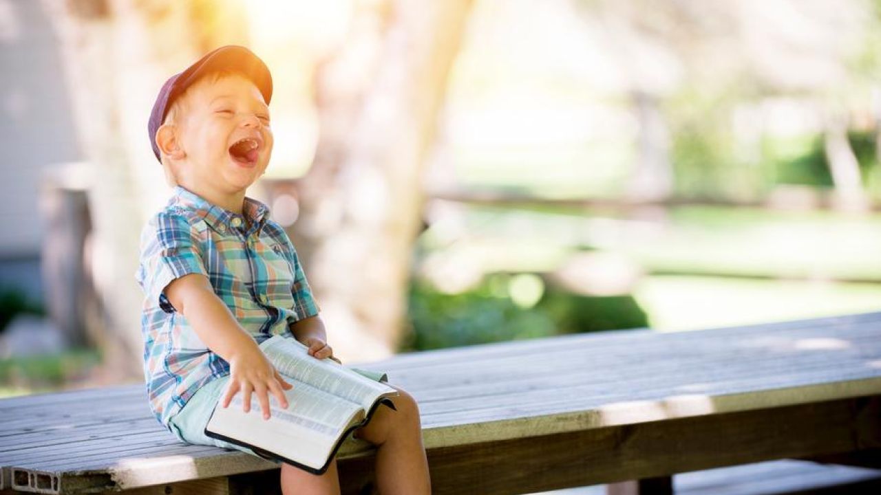 Laughing Child Reading The Bible
