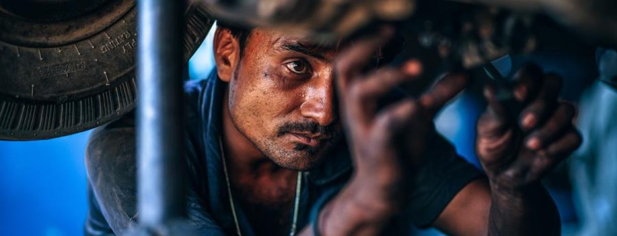 Mechanic Working Hard On A Car