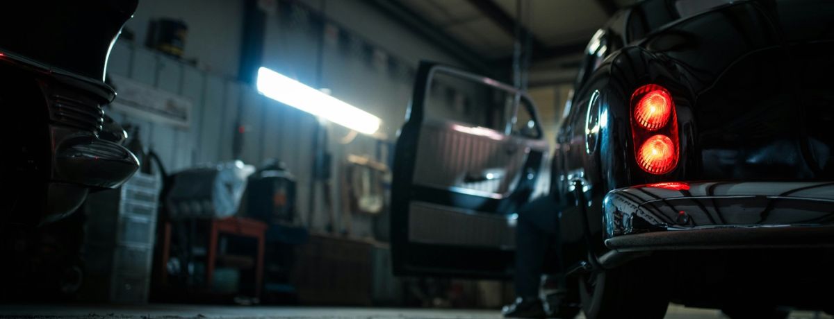 mafia car pulls up in garage