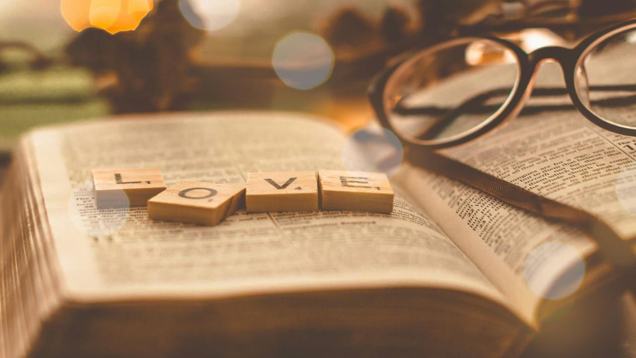 love letters on the bible on a desk with glasses