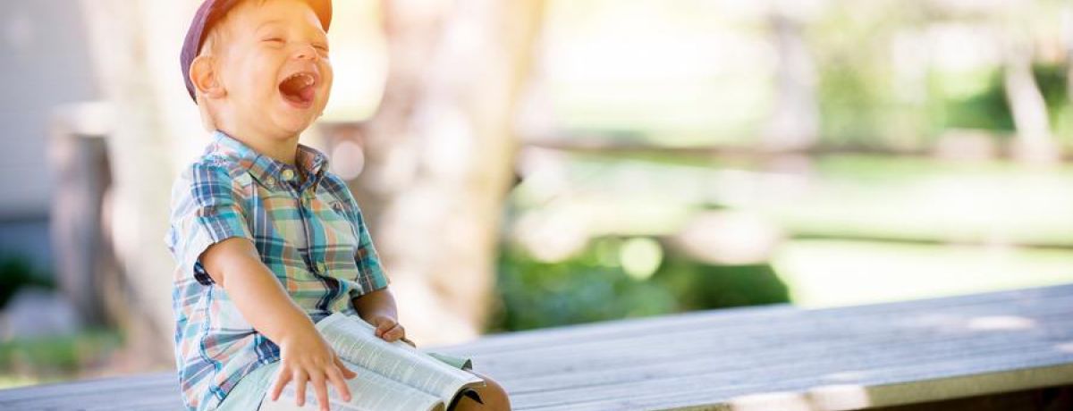 Laughing Child Reading The Bible