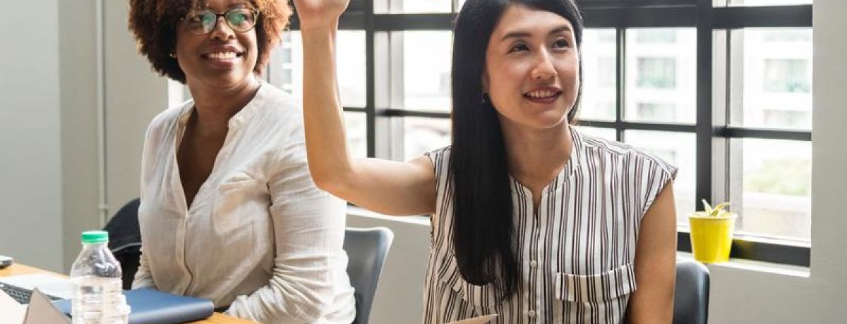 woman raising her hand