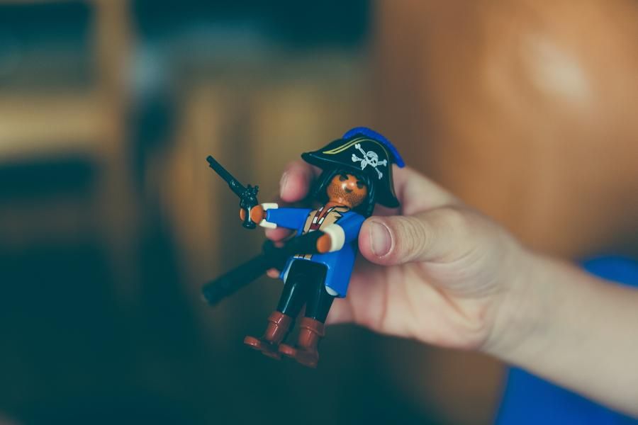 Pirate Toy In The Hands Of A Boy