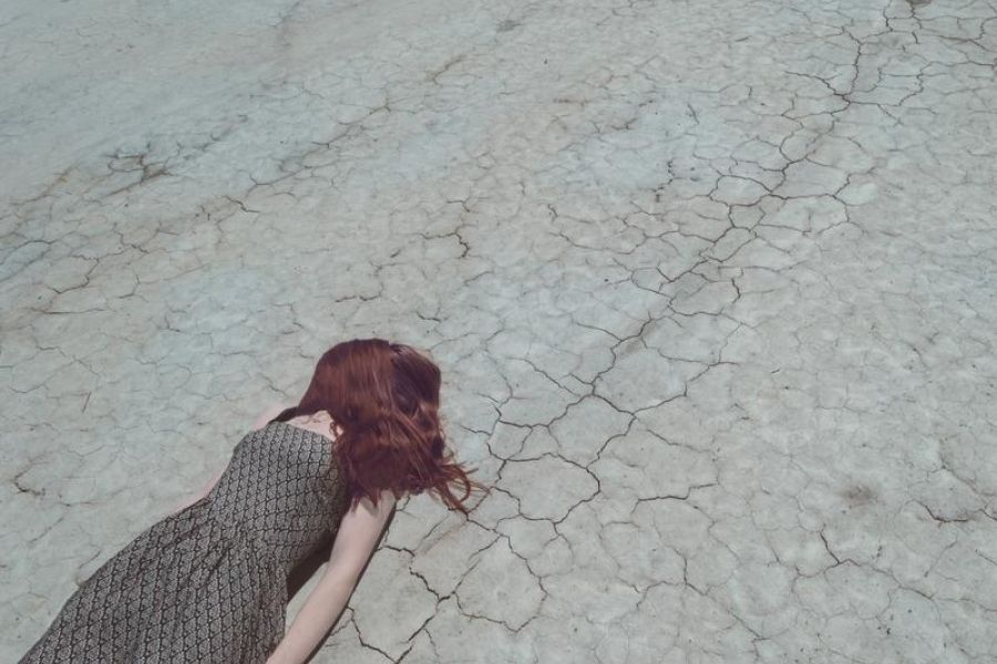 Girl Lost In Desert, laying down