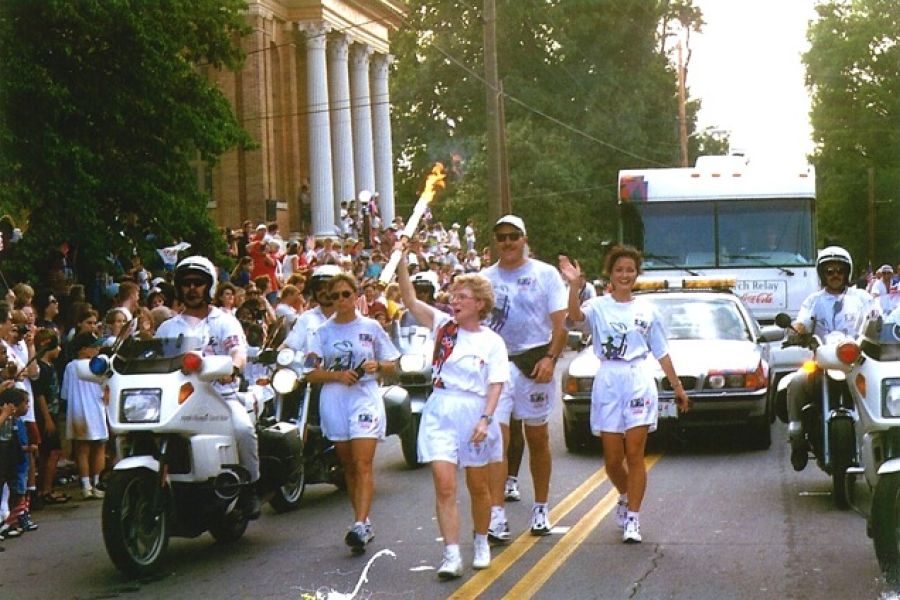 deenie mckeever, carrying 1996 olympic torch in cartersville georgia