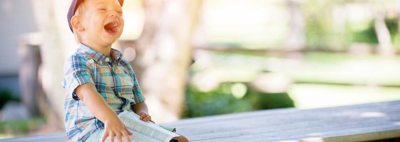 Laughing Child Reading The Bible