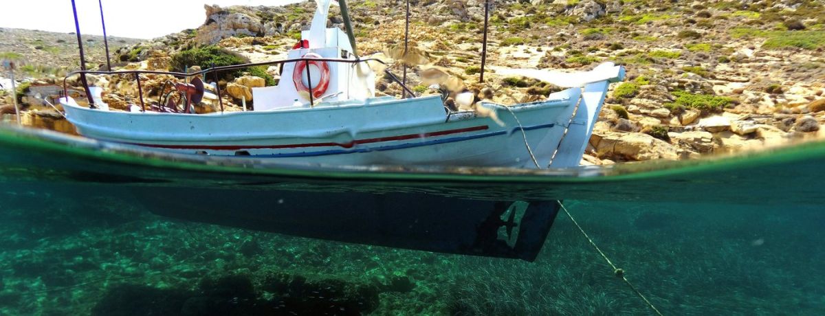 a boat waterline, underwater and above water, by land