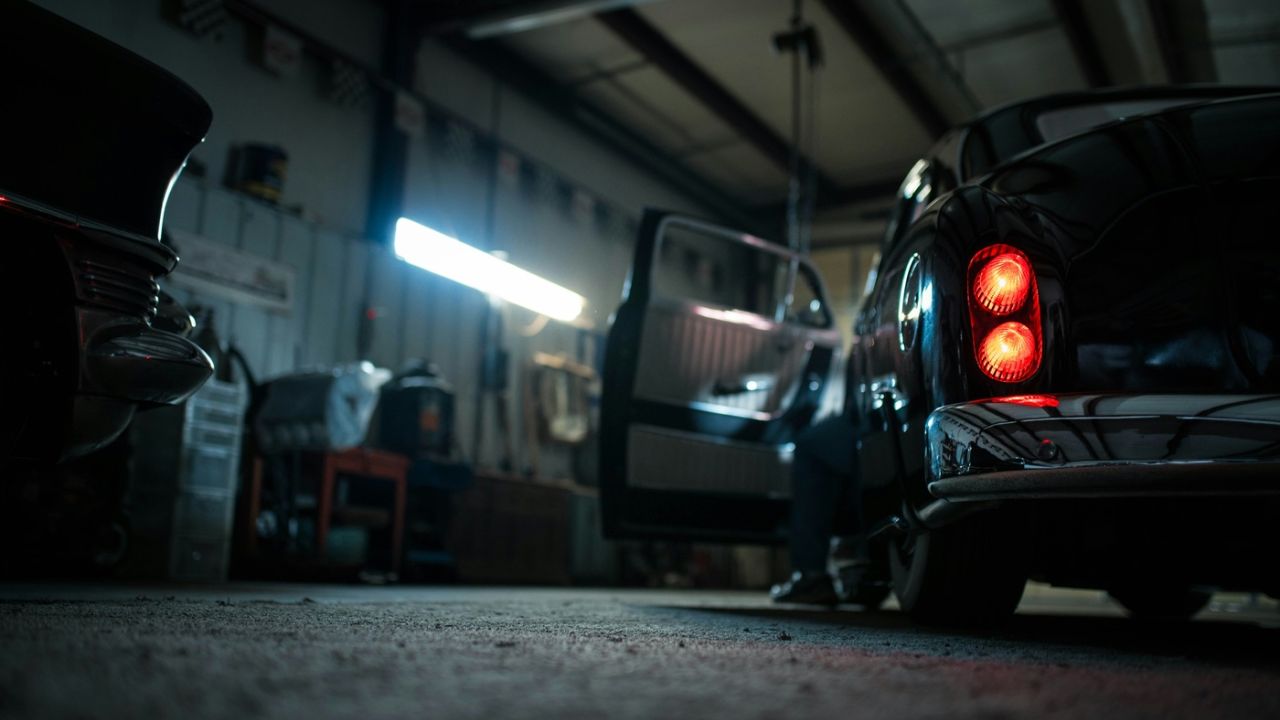 mafia car pulls up in garage