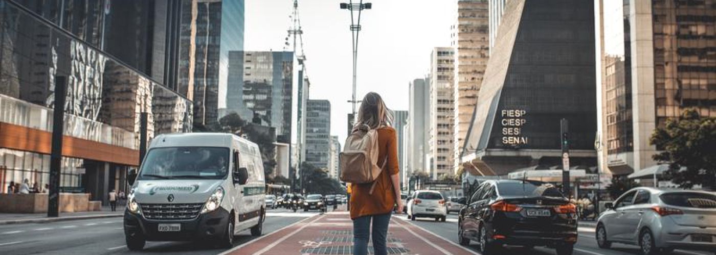 girl walking through high city