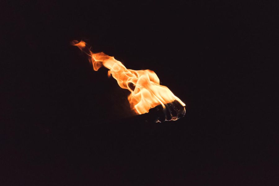 Fire torch in the darkness