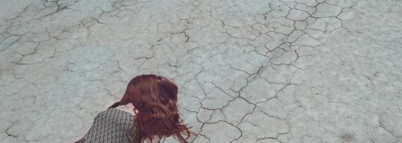 Girl Lost In Desert, laying down