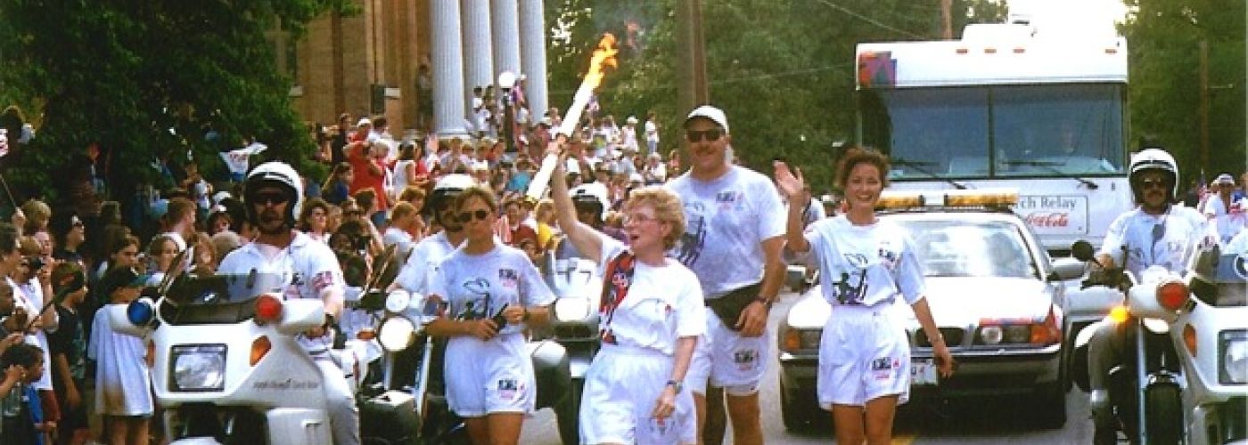 deenie mckeever, carrying 1996 olympic torch in cartersville georgia